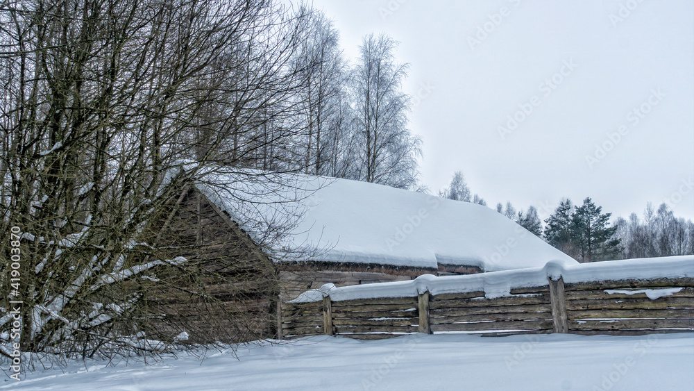 Winter snow covered village house, fence and trees. Nice old village house in the middle of beautiful winter with lots of white snow and trees. Countryside concept. Winter snow covered village house, fence and trees. Nice old village house in the middle of beautiful winter with lots of white snow and trees. Countryside concept.