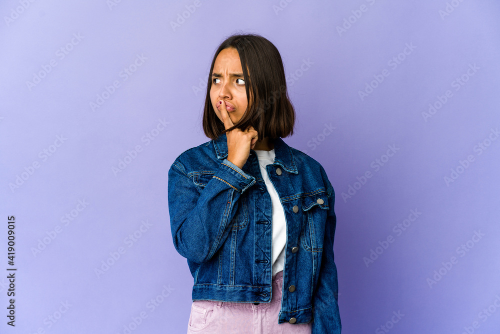 Young mixed race woman unhappy looking in camera with sarcastic expression. Young mixed race woman unhappy looking in camera with sarcastic expression.