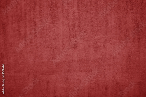 The texture of red natural Italian leather with a pile. red background.