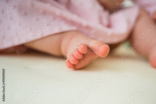 Close-up of the child's fingers on the background with space for text
