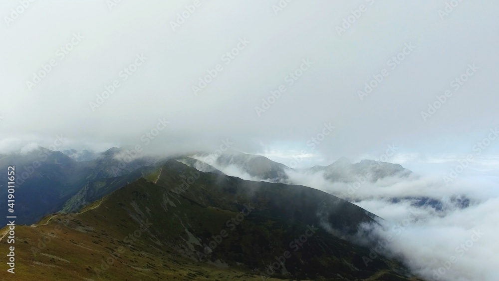 Koscielec from Kasprowy Wierch. Mountain covered in the clouds. High quality photo