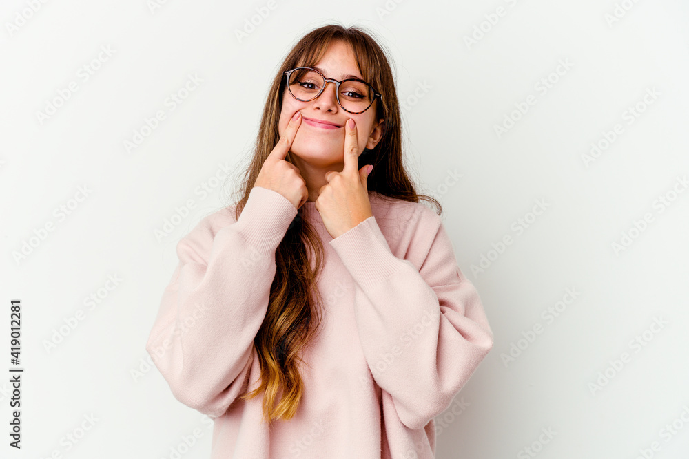 Young caucasian cute woman isolated on white background doubting between two options. Young caucasian cute woman isolated on white background doubting between two options.