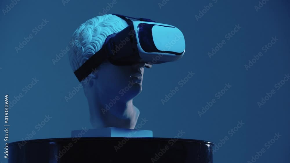 A greek head sculpture in VR glasses on the stand - blue lighting from different angles A greek head sculpture in VR glasses on the stand - blue lighting from different angles