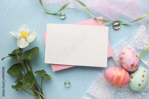 springtime. easter greeting card with easter eggs, flowers and willow twigs 