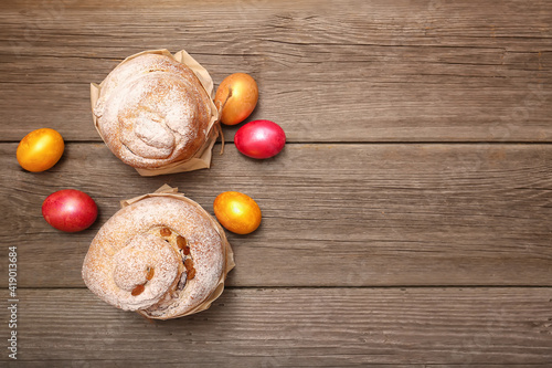 Homemade Easter cakes and  eggs on wooden background