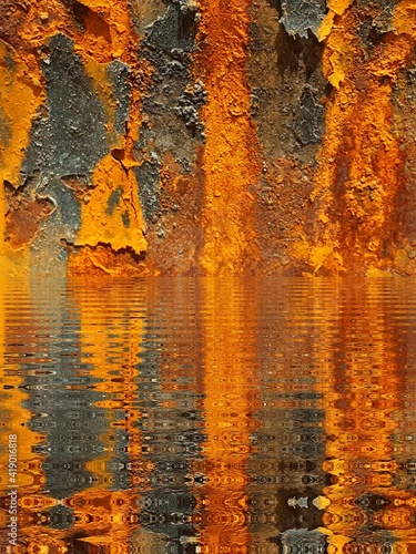 closeup of extreme rust oxidation flakes and patterns in bright orange colour and golden yellow with water reflection and ripple effect