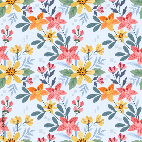 Colorful flowers on a light blue color seamless pattern for fabric textile background and backdrop.