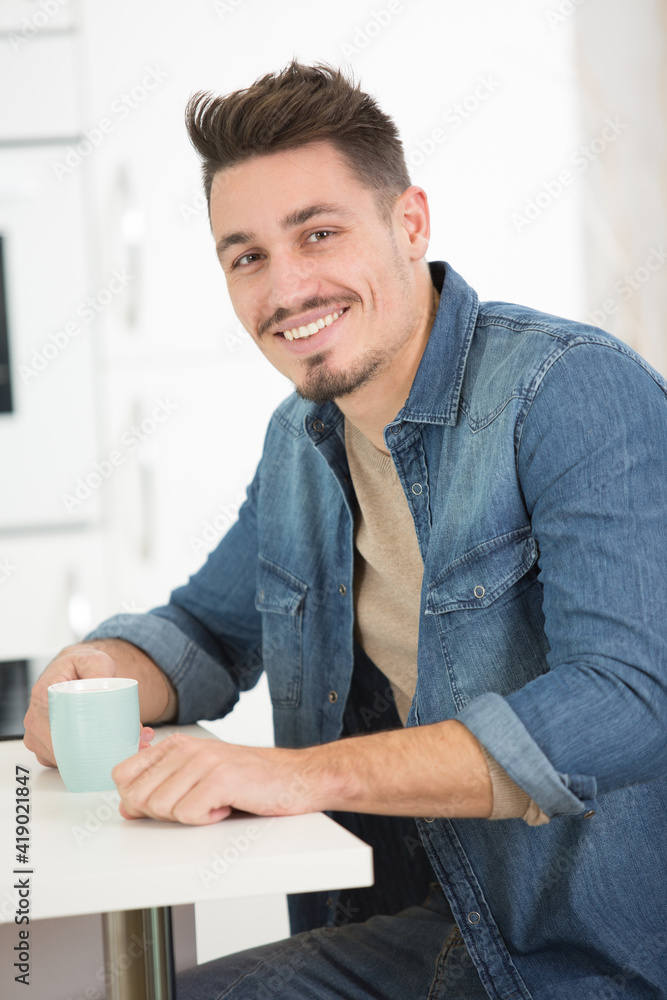 handsome man with coffee sitting handsome man with coffee sitting