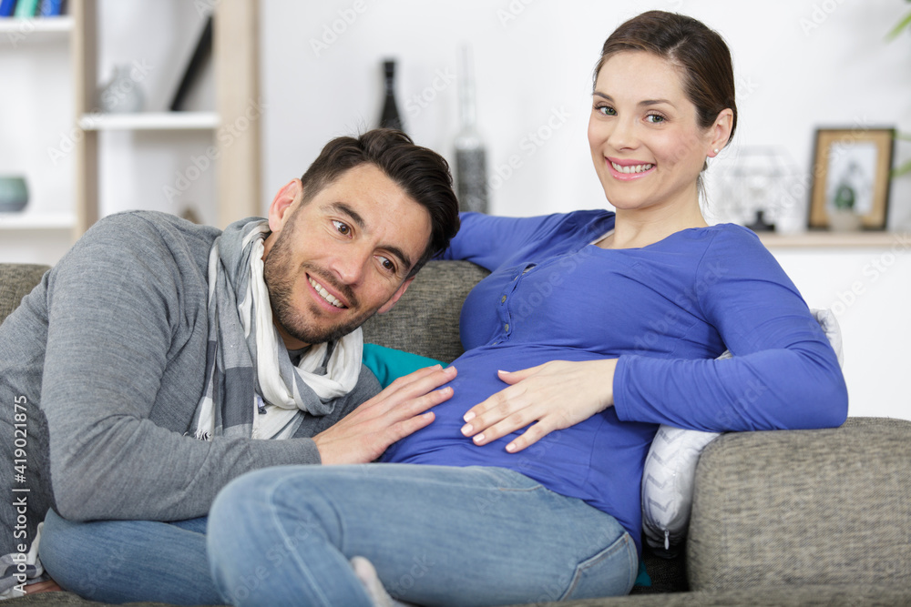 portrait of a happy pregnant woman with her husband portrait of a happy pregnant woman with her husband