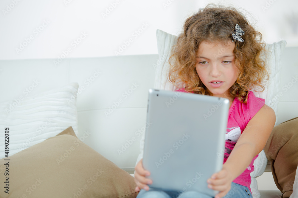 Girl using a digital tablet Girl using a digital tablet