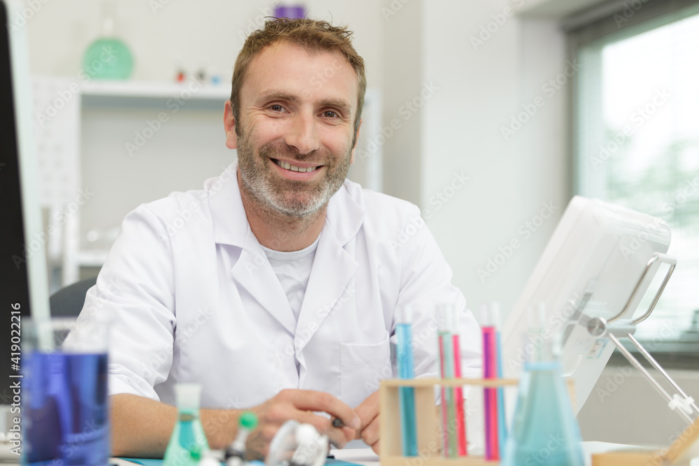 portrait of cheerful handsome scientist portrait of cheerful handsome scientist