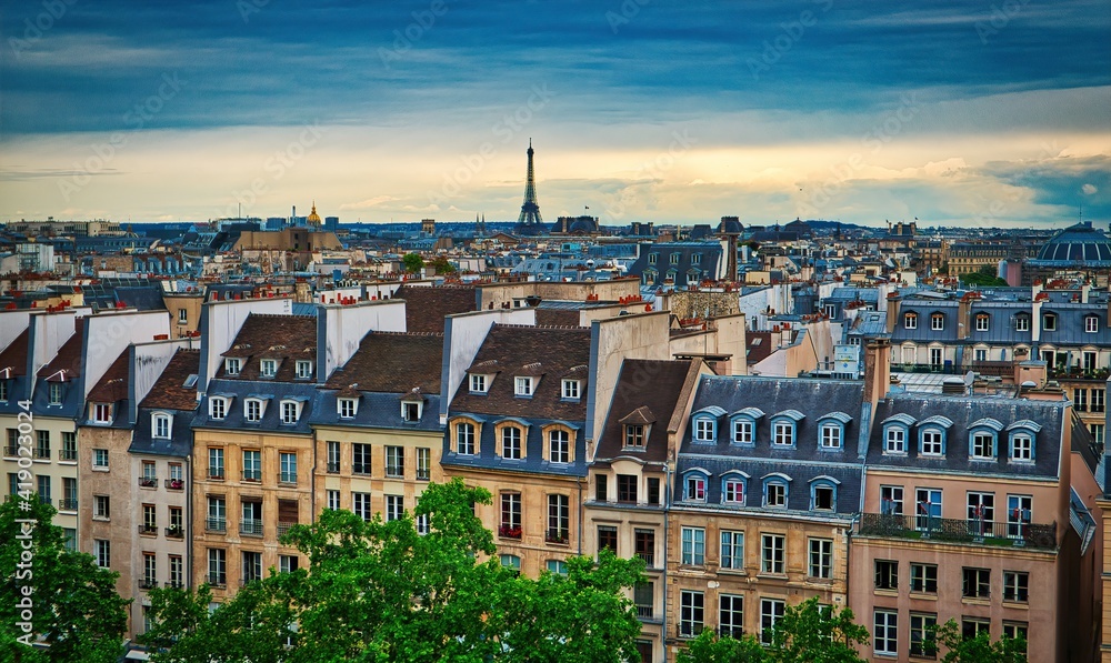 Skyline of Paris with Eiffel Tower at sunset in Paris, France. Eiffel Tower is one of the most iconic landmarks of Paris. Skyline of Paris with Eiffel Tower at sunset in Paris, France. Eiffel Tower is one of the most iconic landmarks of Paris.