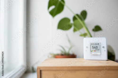 CO₂ sensor monitor. Indoor air quality sensor. Healthy work environment. Work control proper ventilation in your levels airflow in the room. Carbon dioxide levels and airflow. Smart home	