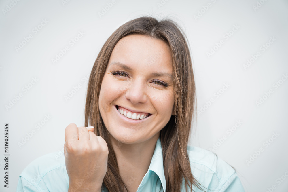 Close up portrait of young cheerful happy celebrating business woman with white perfect smile making winner gesture. Business success Close up portrait of young cheerful happy celebrating business woman with white perfect smile making winner gesture. Business success