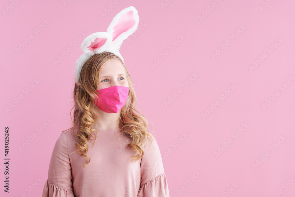 modern girl in pink dress with pink mask on pink