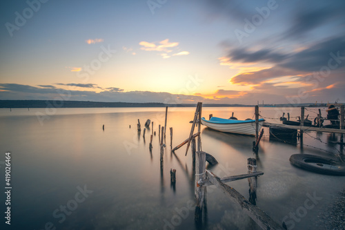 Small dock and fishing boat at fishing village, long exposure hdr  © ValentinValkov