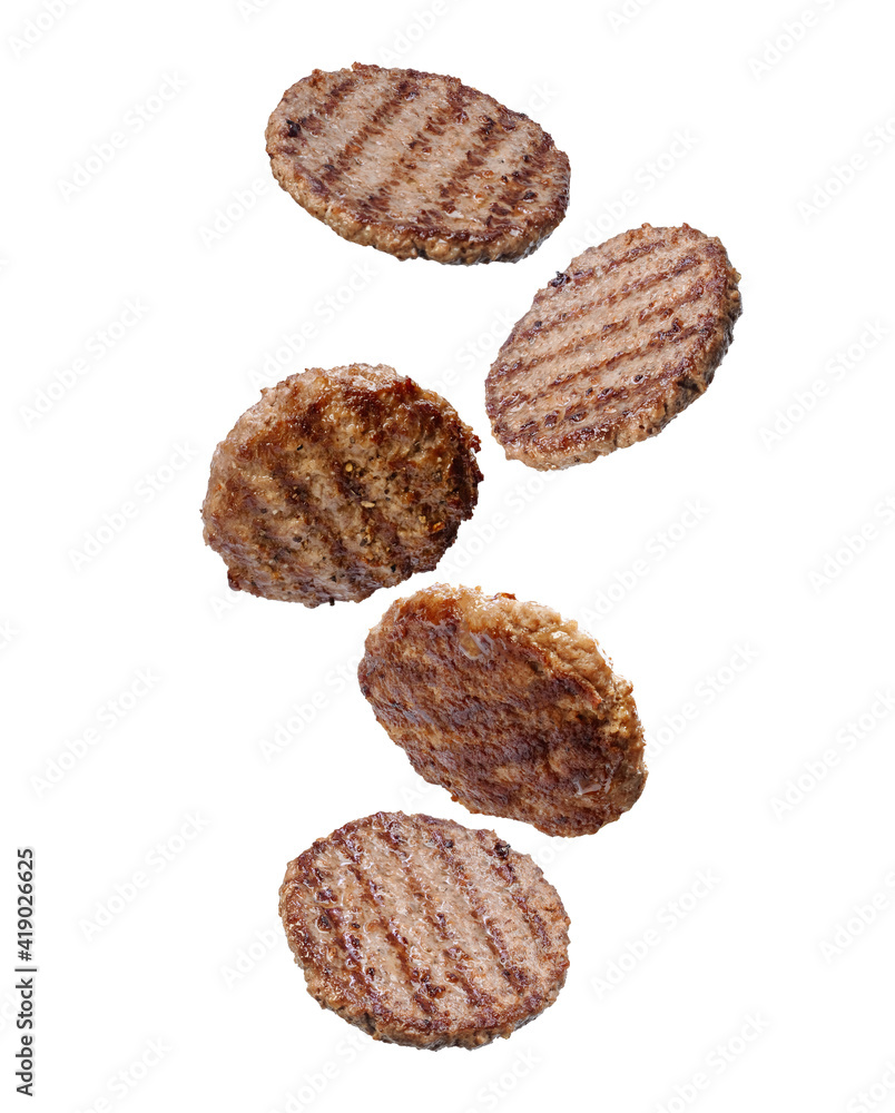 Falling grilled hamburger meat isolated on white background Falling grilled hamburger meat isolated on white background