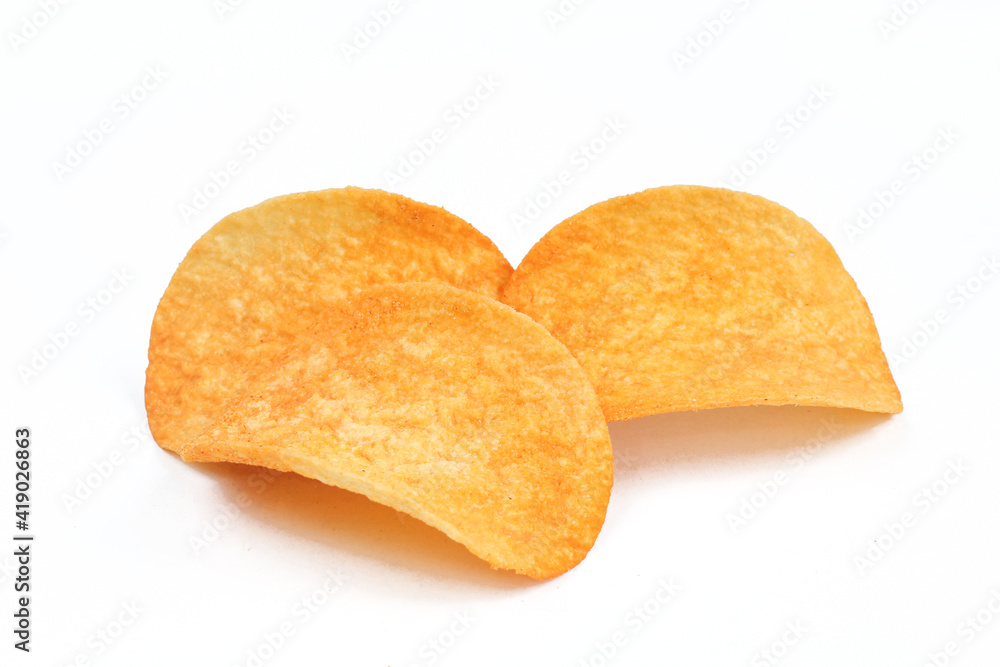 Three slices of paprika chips isolated on white background. Junk food Three slices of paprika chips isolated on white background. Junk food