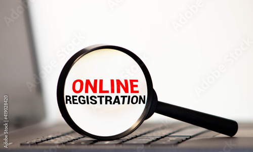 Text ONLINE REGISTRATION on magnifying glass.