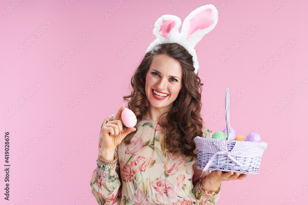 woman with long wavy brunette hair on pink woman with long wavy brunette hair on pink