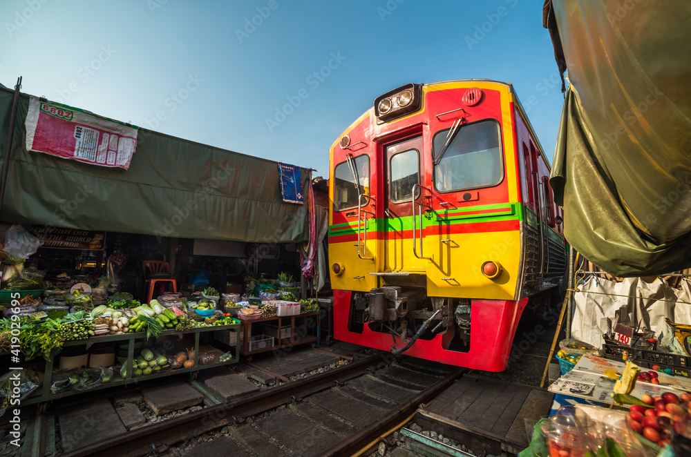 Umbrella Market on the Railroad Track on a Sunny Day