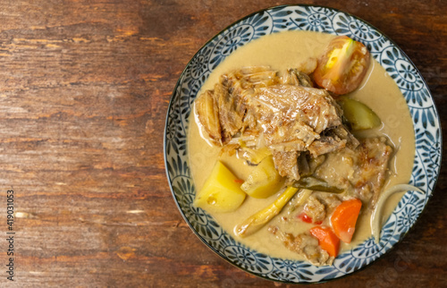 Malaysian dish salted fish curry or locally known as Gulai Ikan Masin.  photo
