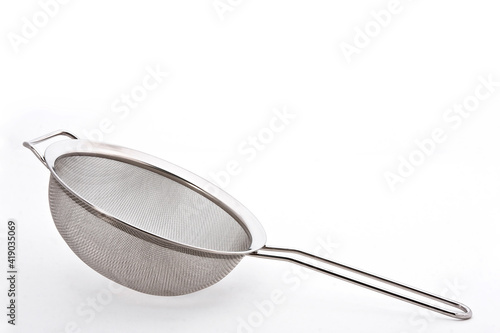 Metal or stainless-steel kitchen strainer, kitchen tool, isolated on white background with space for text