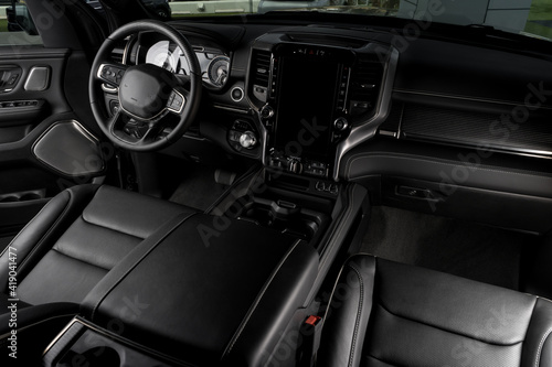 front part of Interior of new car with luxurious details, leather seats and touch screen