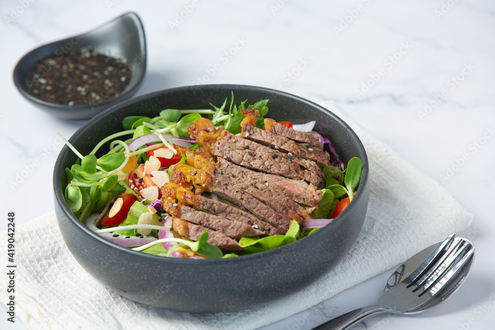 Grilled Beef Steak salad with vegetables and sauce. healthy food. Grilled Beef Steak salad with vegetables and sauce. healthy food.