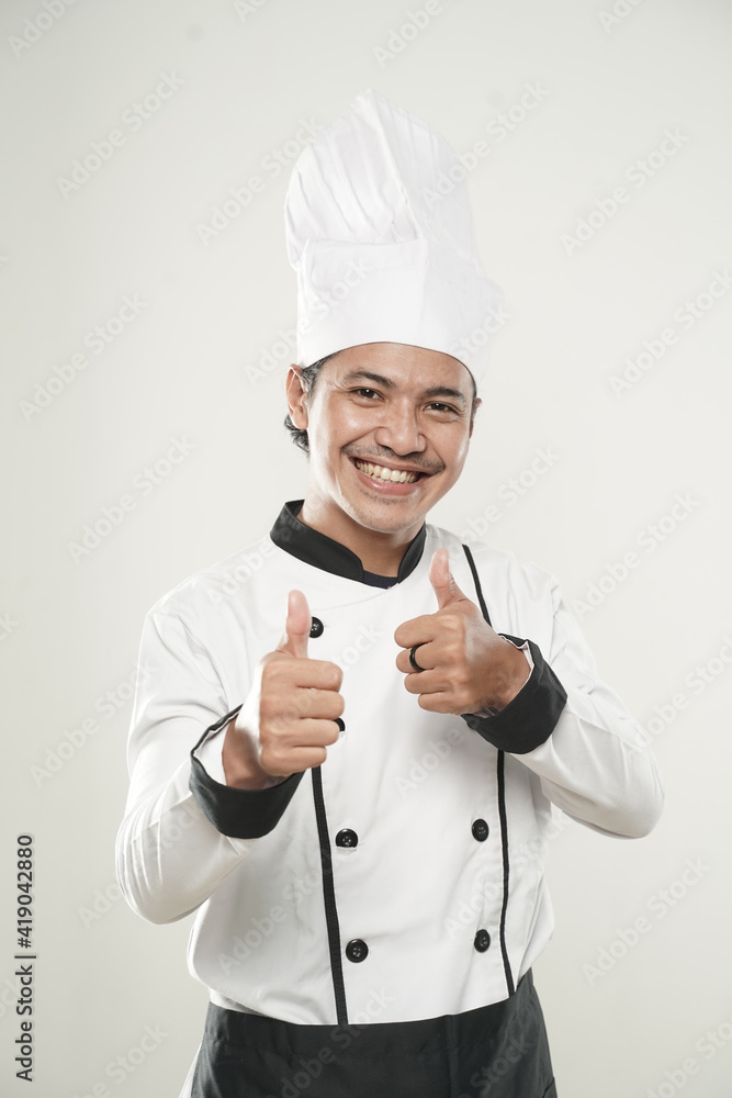 portrait of asian Smiling chef. Isolated over white background. Gourmet.
