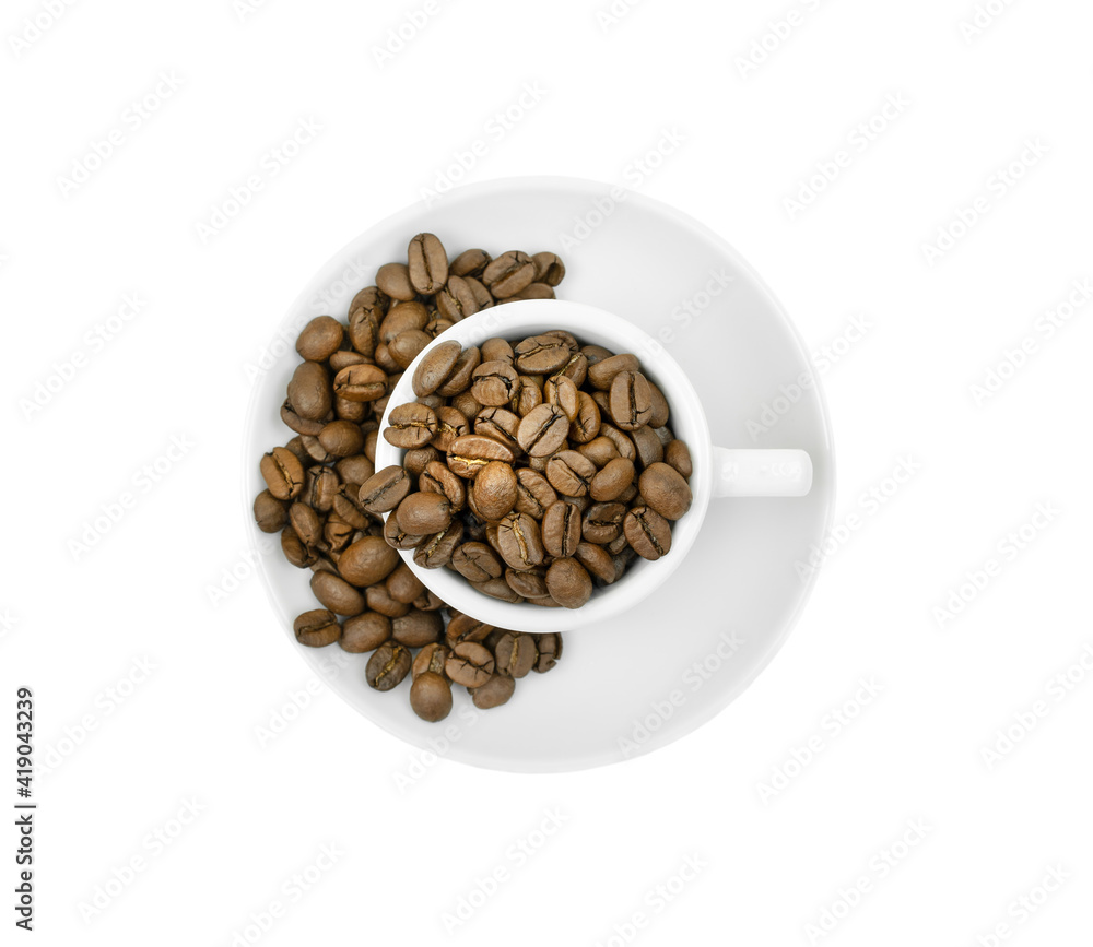 A white cup with coffee beans is isolated on a white background. Top view A white cup with coffee beans is isolated on a white background. Top view