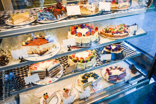 Cake on shelf with cake many variety on store bakery shop