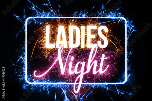 Ladies Night in bright sparkler effect on black background.