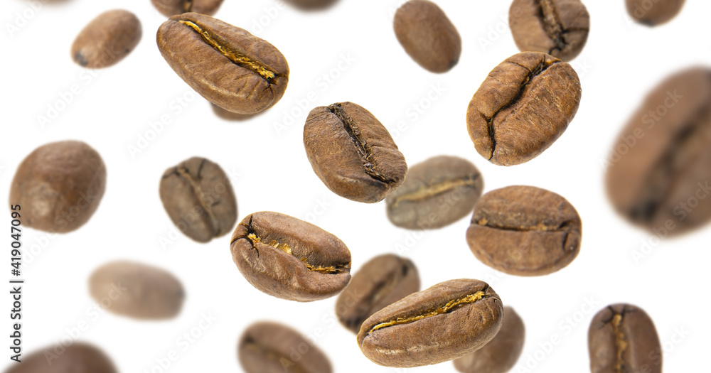 Coffee beans fly close-up on a white background. Levitation of coffee beans Coffee beans fly close-up on a white background. Levitation of coffee beans