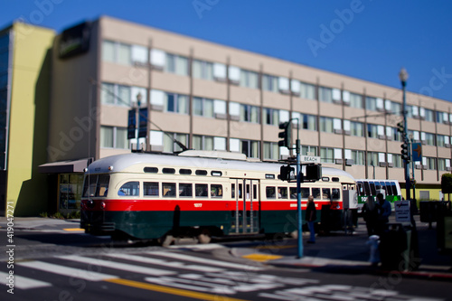 San Francisco Cable Trolley Car moves through the street California people-mover transportation. Tilt-shift lens photography effect.