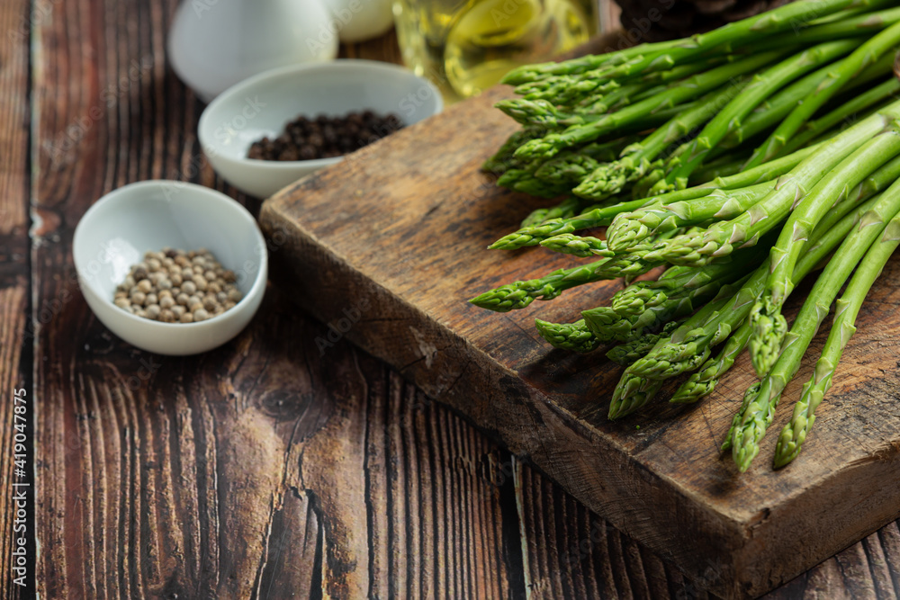 fresh green asparagus on wooden background fresh green asparagus on wooden background