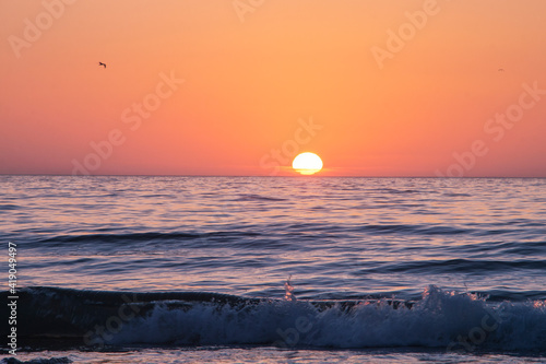 Fototapeta Naklejka Na Ścianę i Meble -  Welcoming the sunrise on the Black Sea coast in the morning