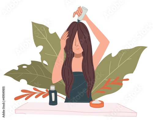 Female character caring for hair applying mask
