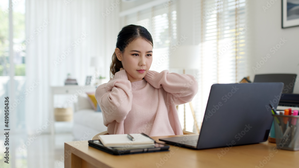 Attractive beautiful young asia female feel tired overworked negative impact health life stretching for break time relax stress relief in concept problem work remotely from home or burnout syndrome. Attractive beautiful young asia female feel tired overworked negative impact health life stretching for break time relax stress relief in concept problem work remotely from home or burnout syndrome.