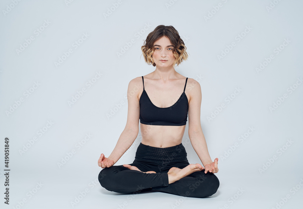 Woman meet legs sitting on the floor meditation yoga asana Woman meet legs sitting on the floor meditation yoga asana