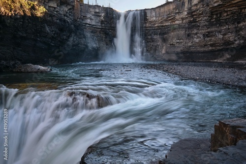 Double waterfall in Bighorn Canyon. Canadian Rockies. White water of Bighorn river in Alberta. Canada 