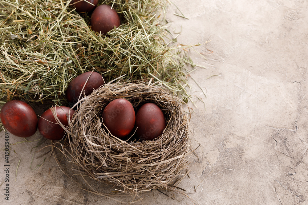 Still life many colorful easter eggs on a textural background. Rustic. Decoration from natural herbs. Easter celebration concept. Still life many colorful easter eggs on a textural background. Rustic. Decoration from natural herbs. Easter celebration concept.