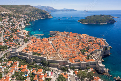 Aerial drone shot of Otok Lokrum in Adriatic sea near Dubrovnik old town in Croatia summer noon