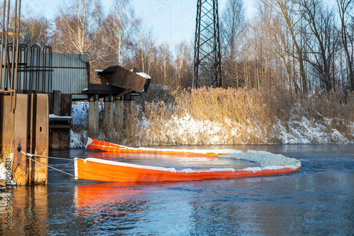 The floating boom prevents foam and debris from contaminating the reservoir. Reducing harmful emissions. Protection of rivers and lakes. Keeping fresh water sources clean. Ecological concept.