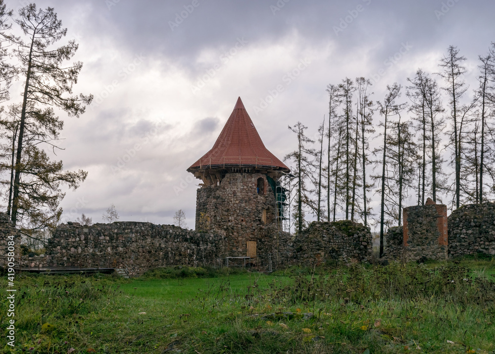 landscape with castle ruins, autumn day, restored tower roof, Ergeme castle ruins in autumn