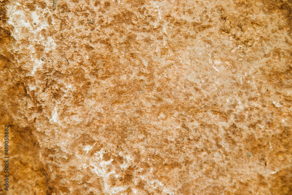 The texture of the stone is beige.Rock, decorative stone. Rough texture of the stone.