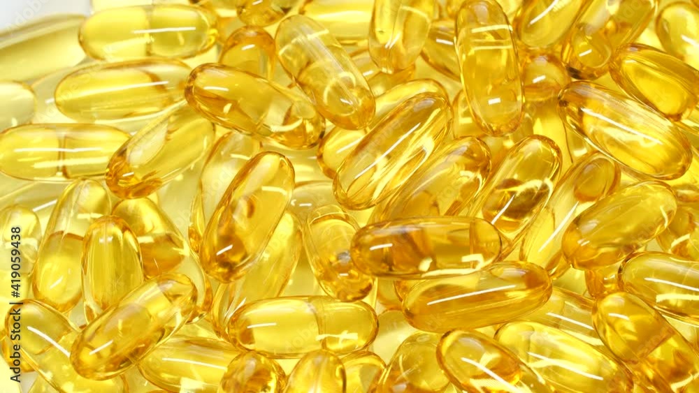 4K closeup Omega 3 fish oil pills background, vitamin E natural capsules texture 4K closeup Omega 3 fish oil pills background, vitamin E natural capsules texture