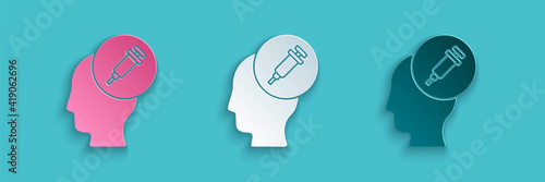 Paper cut Addiction to the drug icon isolated on blue background. Heroin, narcotic, addiction, illegal. Sick junkie with a syringe and medical pills. Paper art style. Vector.
