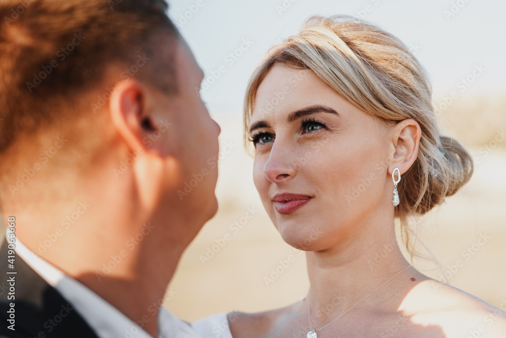 Portrait of a bride and groom in a sunset light Portrait of a bride and groom in a sunset light