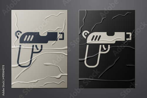 White Pistol or gun icon isolated on crumpled paper background. Police or military handgun. Small firearm. Paper art style. Vector.